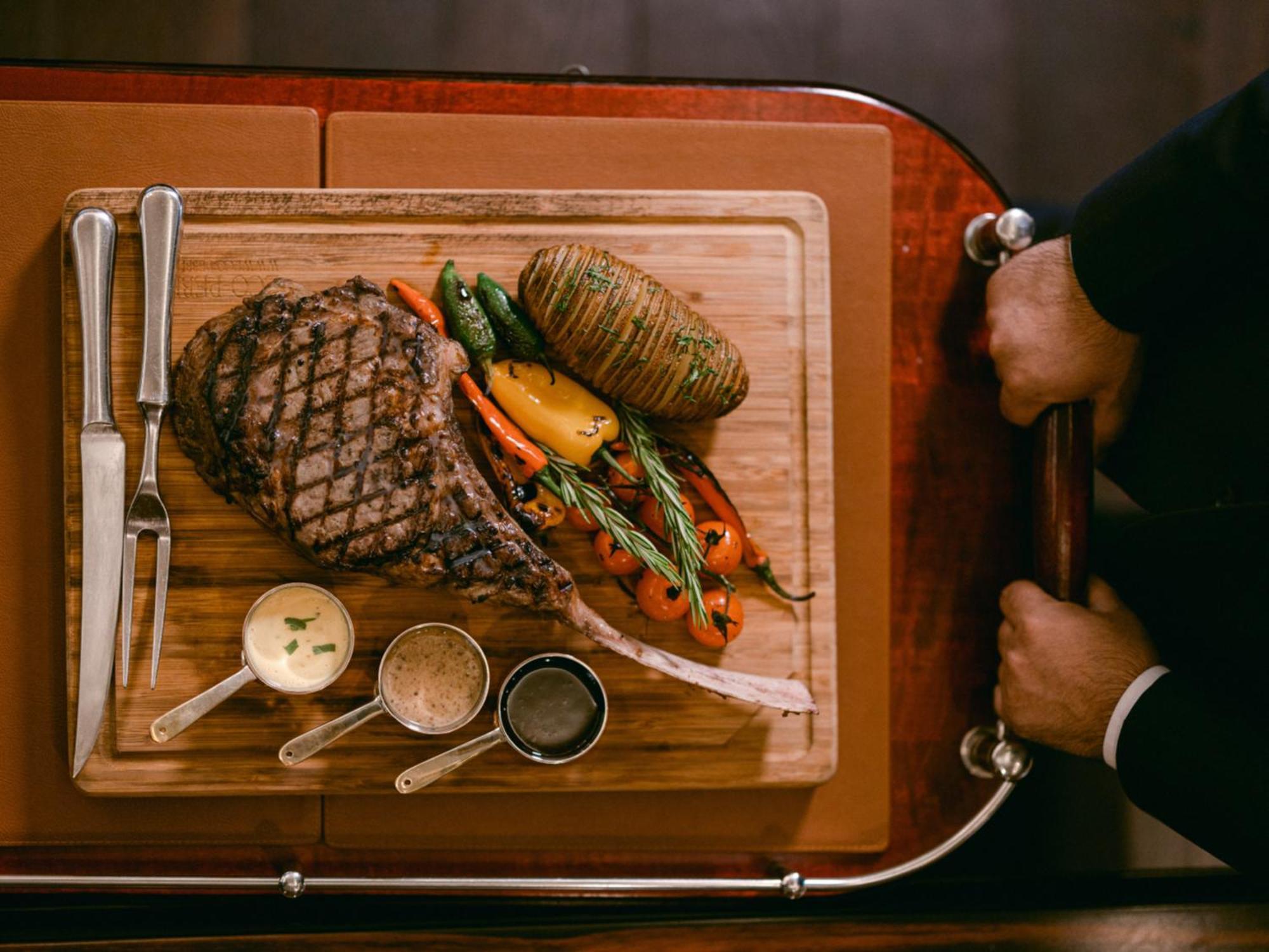 Al Habtoor Palace - Preferred Hotels & Resorts Dubai Exterior photo A steak prepared on a serving cart